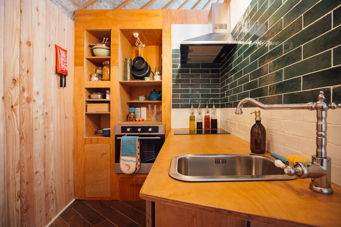 Kitchen equipped with an oven, stove and