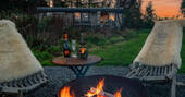 Fire pit area with table and seating for two