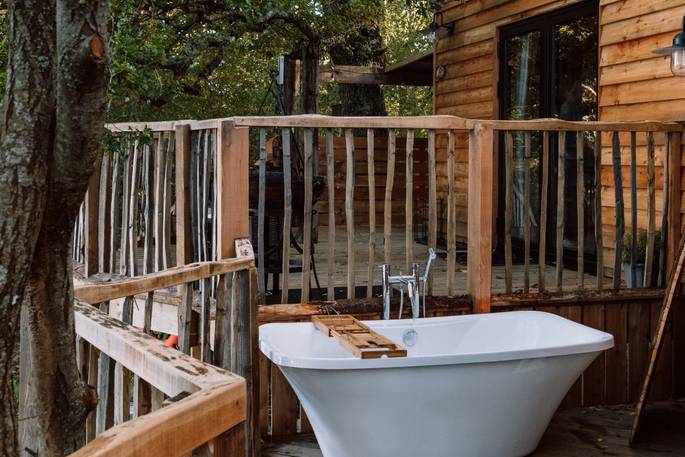 Beneath the Branches cabin outdoors bath tub, Furzefield Farm, Ashurst, Sussex