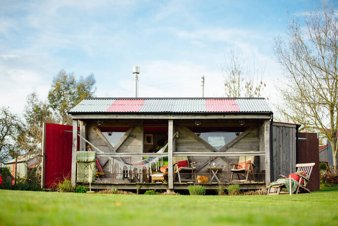Sunny exterior of Stripy Bothy, Monmouthshire in Wales