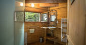 Bathroom with walk in shower at Gauthie Lakeside Treehouse, Dordogne, France