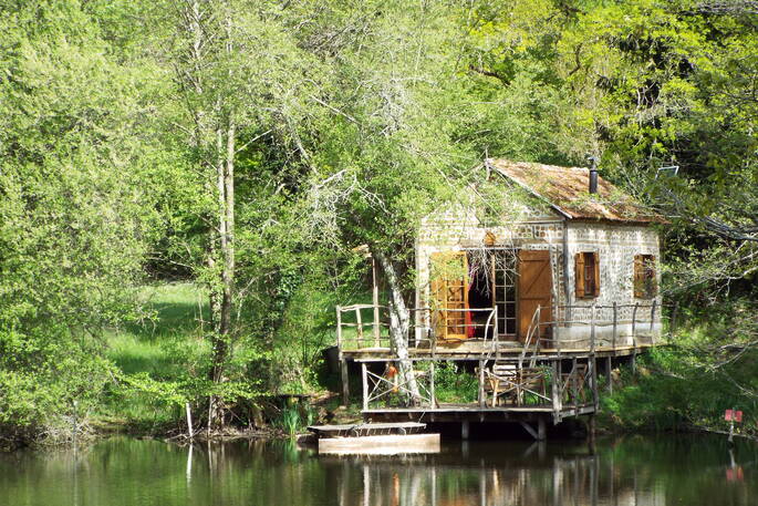 Exterior view of the Fisherman's Cabin across the river in Aquitaine, France