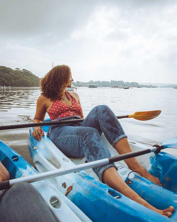 Person kayaking on river