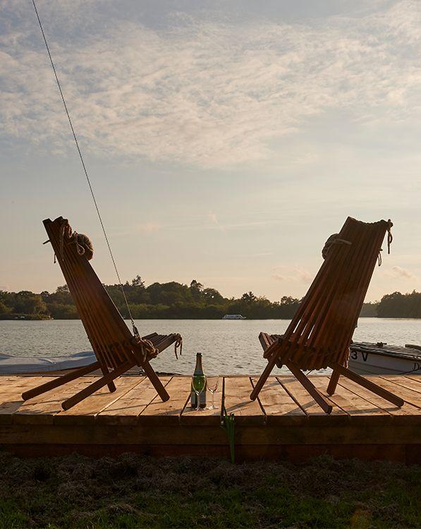 Two deck chairs overlooking the waterside