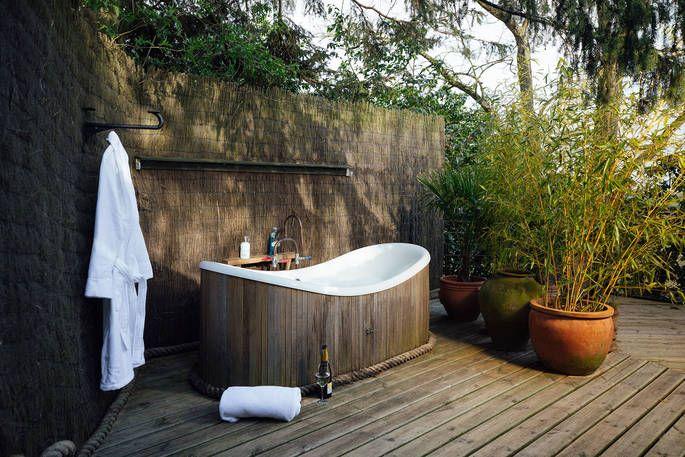 Outdoor bath on treehouse decking 