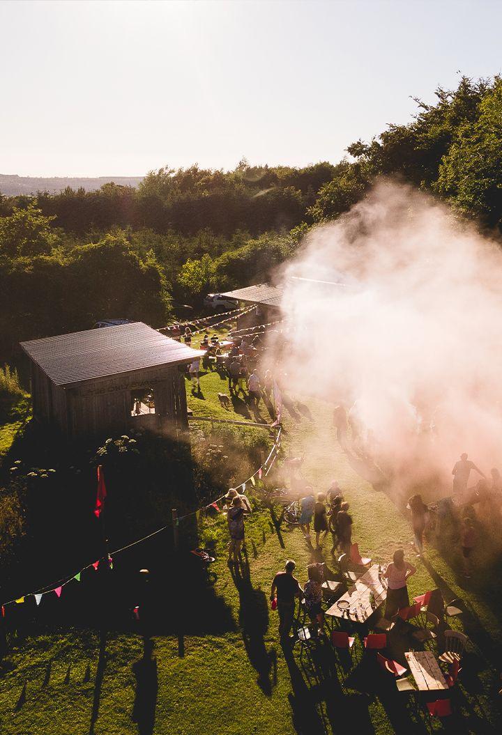Into the woods exterior with people and bunting 