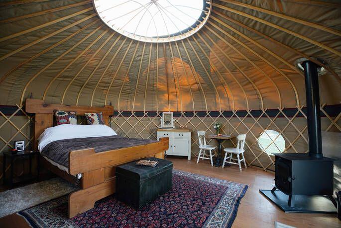 Bed in yurt with sky light