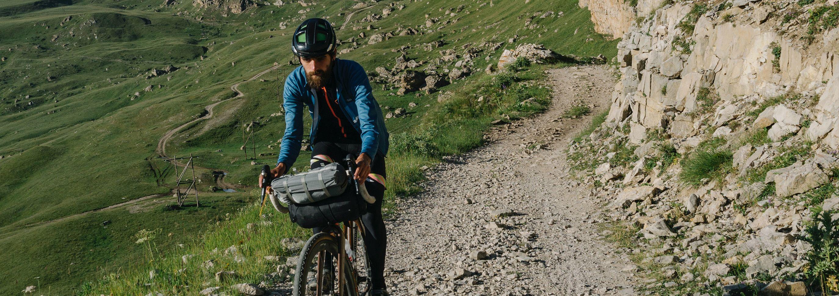 Person cycling on dirt track 