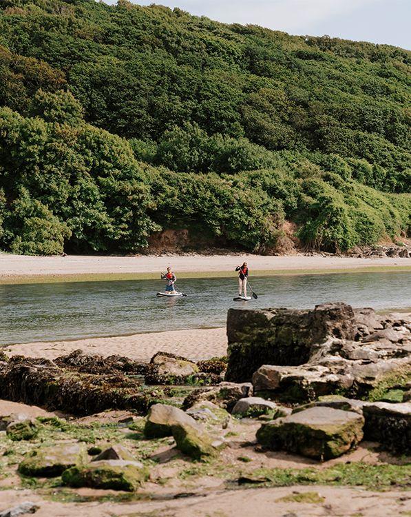 Two people paddleboarding