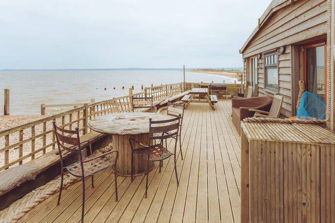 Cabin on the beach with decking leading onto the beach 