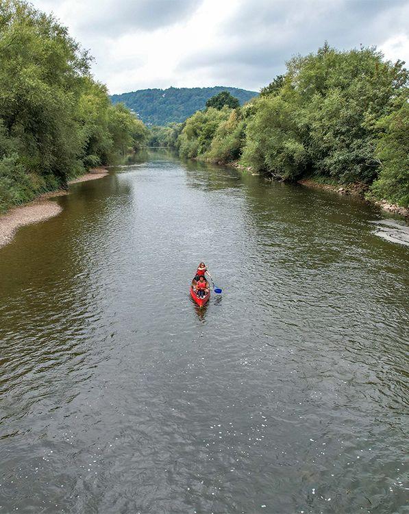 People Kayaking on river 