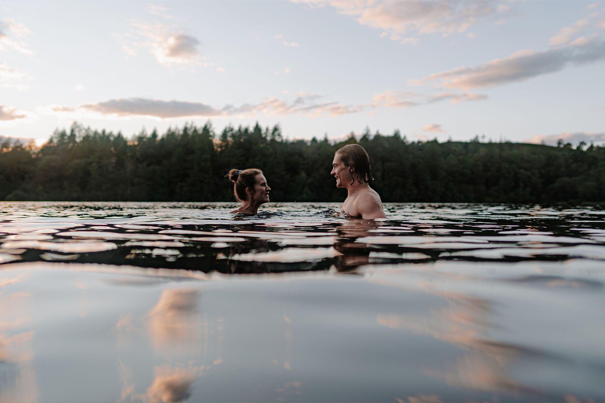 Two people wild swimming together 