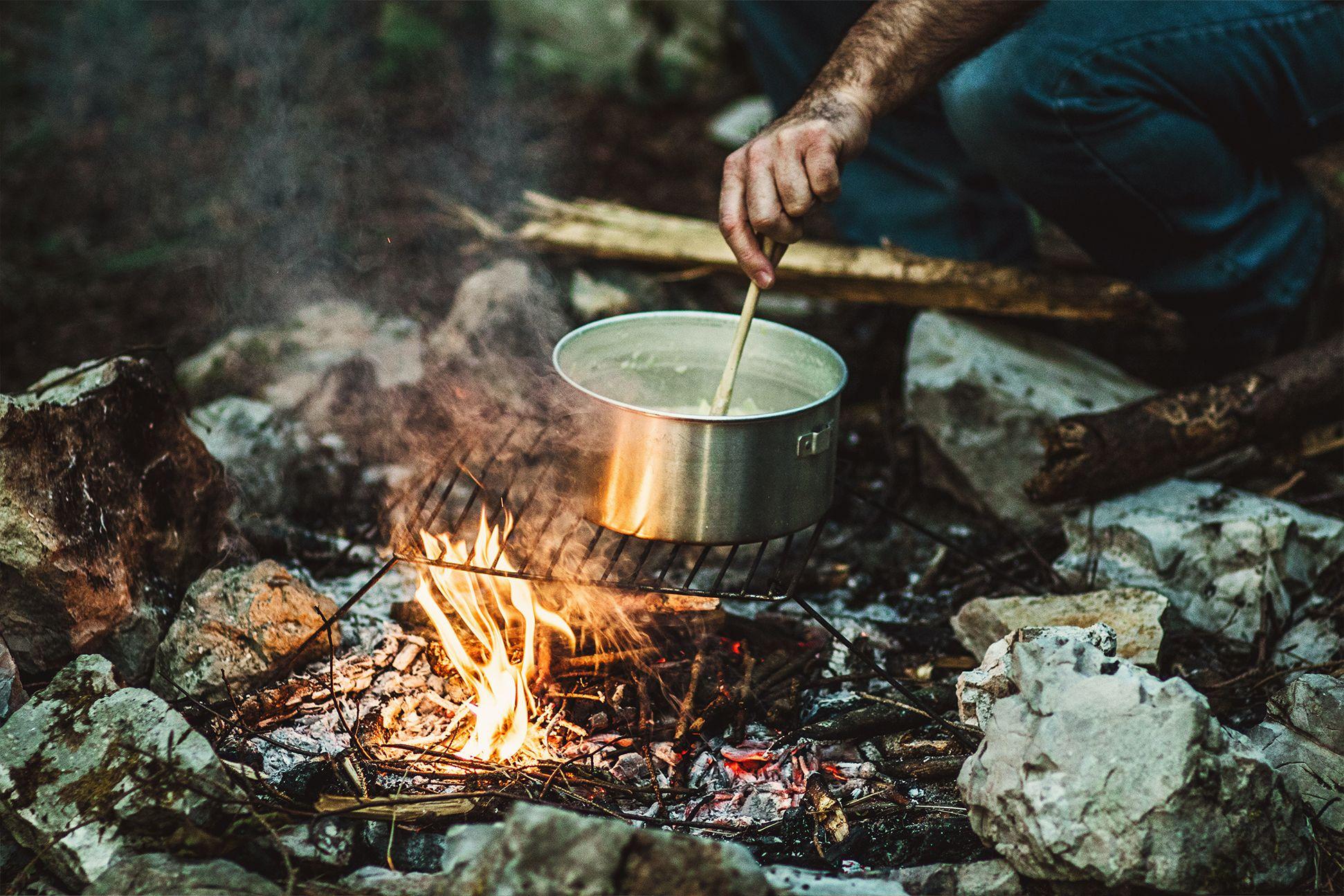 Cooking Cheese fondue on the campfire 
