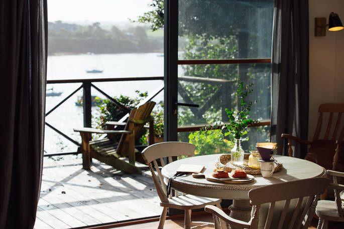 Bowcombe Boathouse table with breakfast and view of the lake 