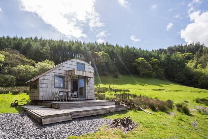 Caban Cader with woodland backdrop and firepit 