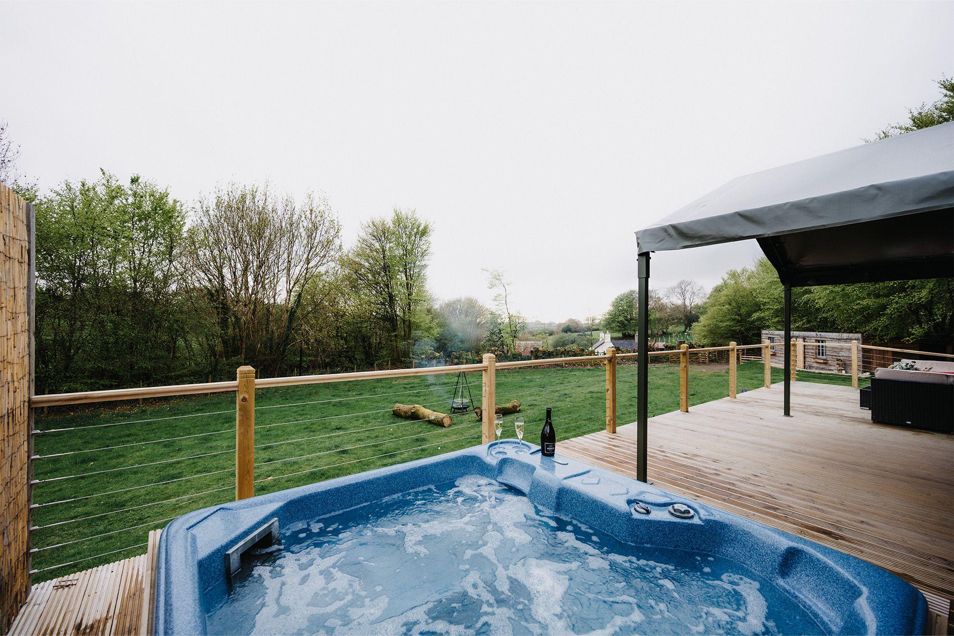  Flora & Fauna decking with hot tub and view of countryside 