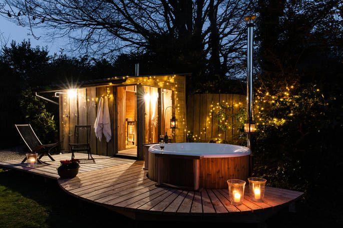 Jake's place cabin with hot tub on decking and fairy lights