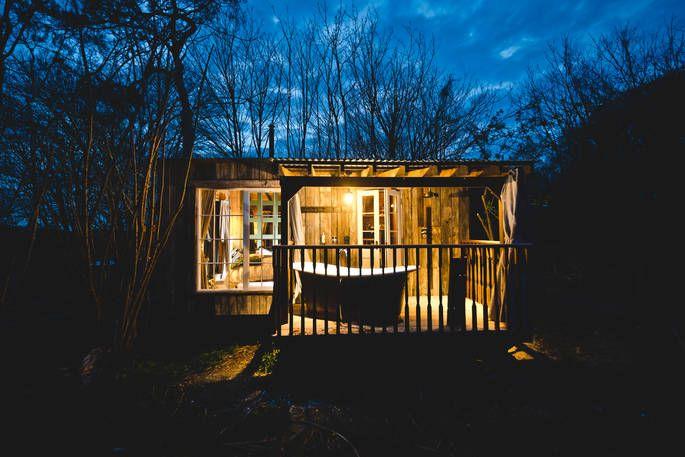 Poppy Treehouse exterior at night with lighting 