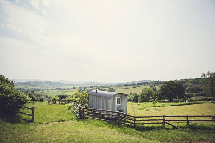 Shepherd's Hut at Argoed exterior in field with a view of the mountains 