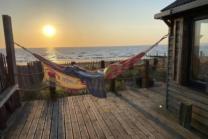 The Beach House hammock with beach view and sunset 