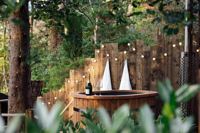 The Forager’s Cabin hottub with towels and fairy lights 