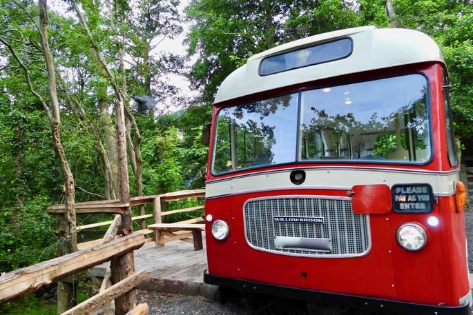Willowbrook bus exterior with decking and woodland 