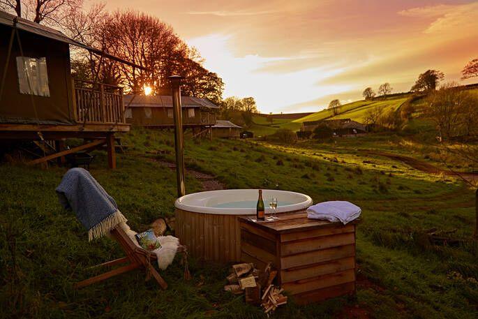 Hot tub with seating and sunset 
