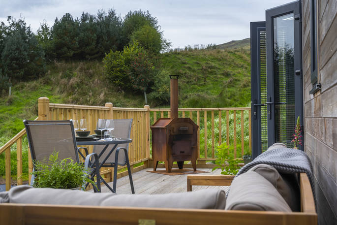 Decking with outdoor seating, table and pizza oven 