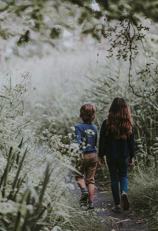 Two children walking in nature 