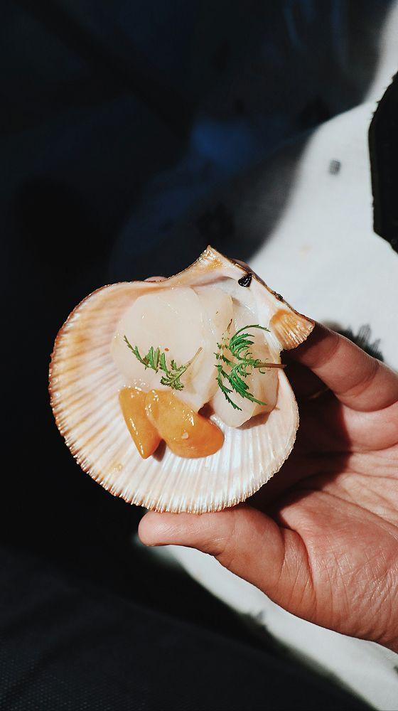 Scallop cooked and served in its shell