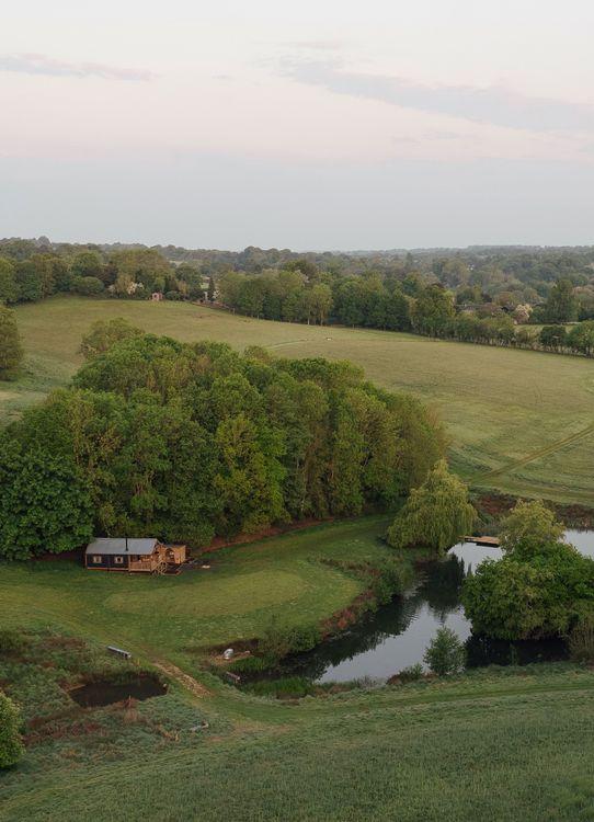 Glamping near Birmingham mobile header. Cabin with lake view