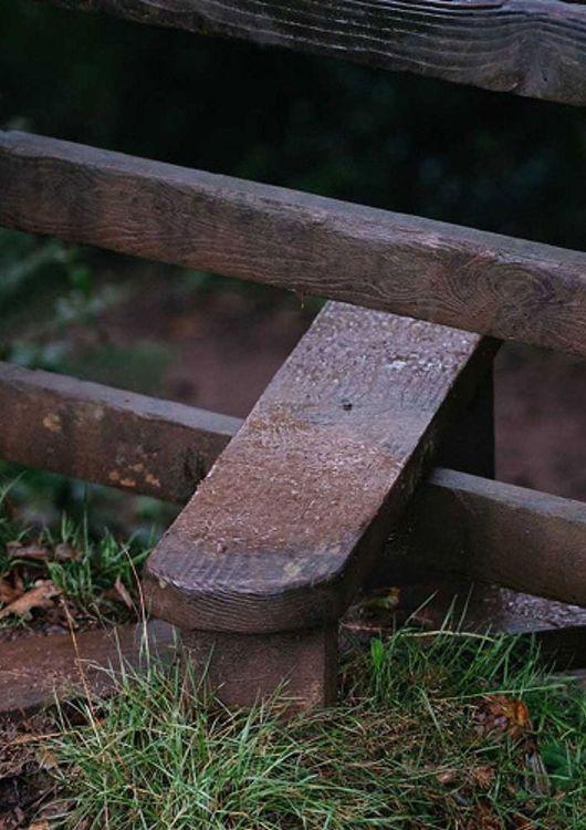 a turnstile on a walking path