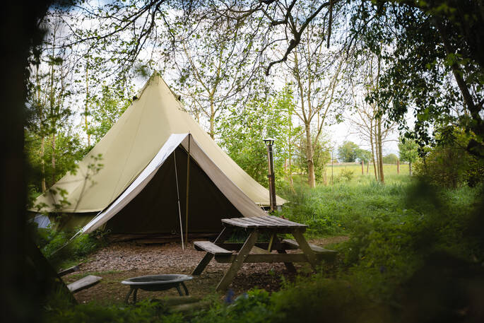 Bell tent and picnic bench