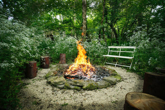 Outdoor Fire Pit and seating area at Old Mill Treehouse, Bath & N.E Somerset