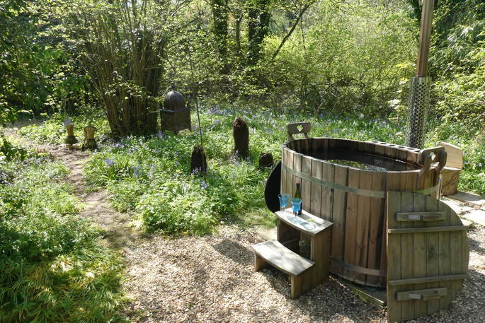The hot tub in the bluebells at Badger's Bower, Chiltern Yurt Retreat in Buckinghamshire 