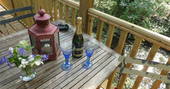 Have a spot of champagne on the decking at Hazel Tree Cabin in Buckinghamshire