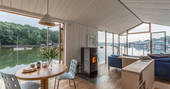 Interior living space of barge Amelie near Falmouth in Cormwall with panoramic river views 