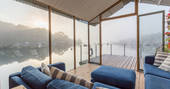 Morning mist on the water and the view down Penryn River from barge Amelie's family-size sofa