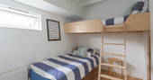 The twin bedroom with bunk beds below deck 