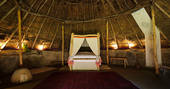 Relax in the huge comfy bed inside The Roundhouse, with goose down duvet
