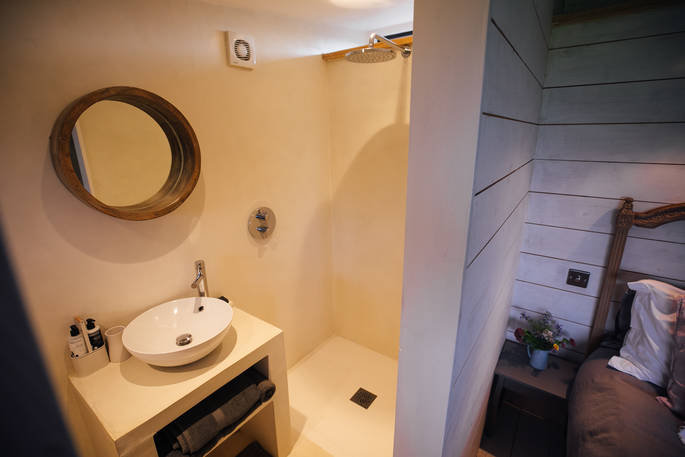 The en-suite bathroom with basin and wet room, at the Observatory in Cornwall