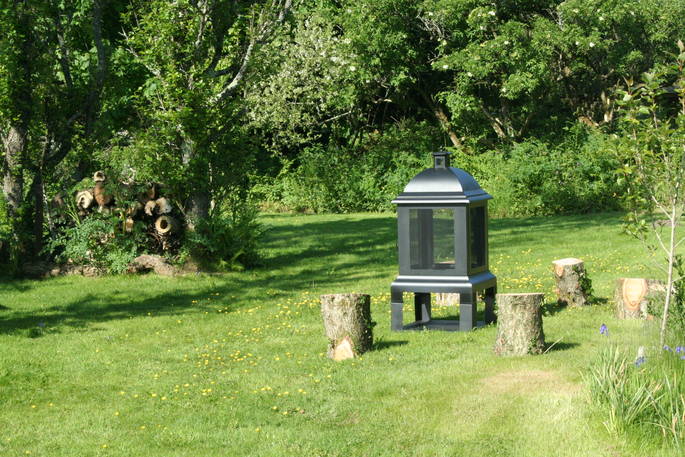 Fire pit in the sunshine outside of both Safari Tents in Little Nook Glamping, Cornwall