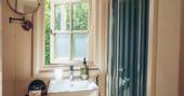 16 - Bathroom with a hot shower, sink and toilet
