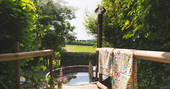 Relaxing communal wood-fired hot tub at Lombard Farm, Cornwall