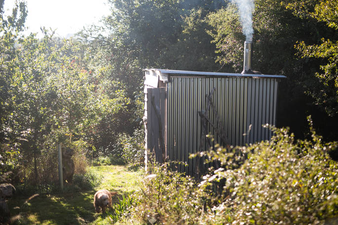 The outdoor tin bathroom unit at Mill Valley Farm in Cornwall