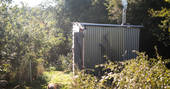 Exterior of bathroom hut at Mill Valley in Cornwall
