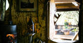 Woodburner inside of The Stumpy Hobbit cabin in Cornwall