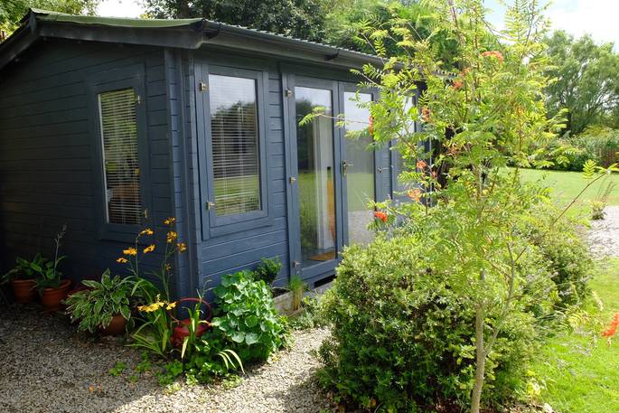 Additional black cabin containing the kitchen/dining area and separate shower room for Sangers Showmans Wagon 