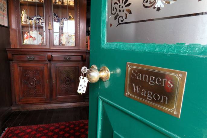 Step through the green front door at Sanger's Showman's Wagon in Cornwall