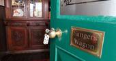 Step through the green front door at Sanger's Showman's Wagon in Cornwall